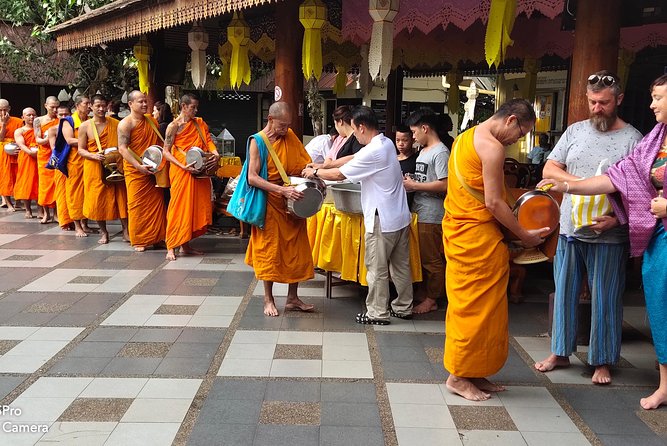 4 highlights: Sticky Waterfall/Elephants/local market /Wat Banden - Alms giving and the Buddhist side of the morning
