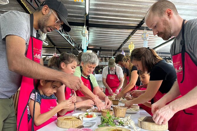 Authentic Thai Cooking Class and Farm Visit in Chiang Mai - The open-air kitchen and bamboo-hut meal
