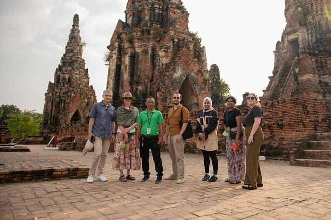 Ayutthaya, Damnoen Floating & Maeklong Railway Market Day Tour - The train through Maeklong Railway Market