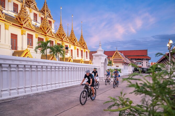 Bangkok: Night Bike Tour with Temples & Flower Market Visit - Loha Prasat and the Old City after dark