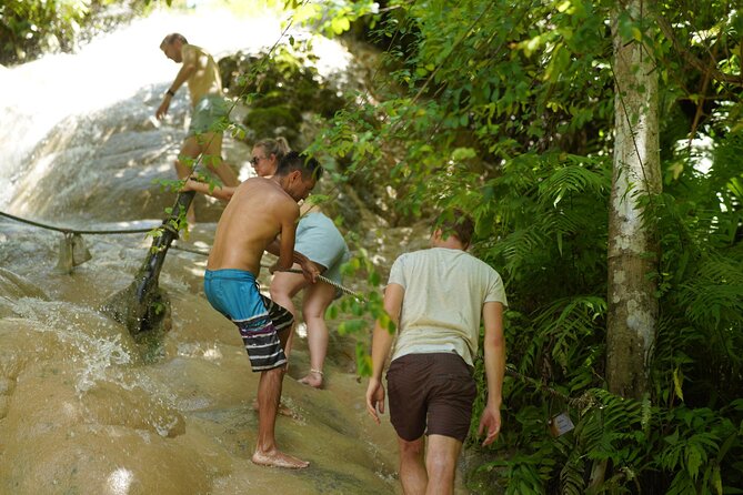 Bua Tong Waterfall Adventure& Huge Cave included Thai Buffet Tour - Climbing the 160-meter waterfall