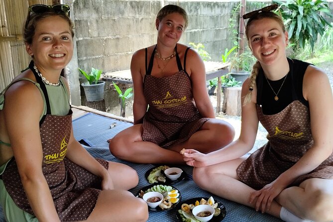 Cooking class in organic garden and local market tour ThaiCottage - Four dishes, several burners, and plenty to eat