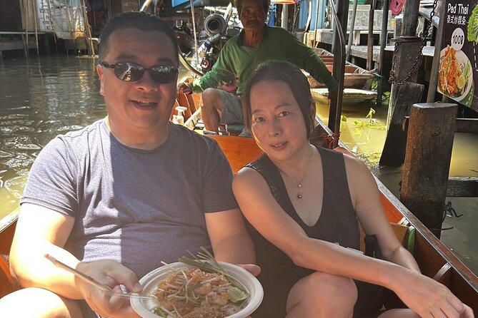 Damnoen Saduak Floating Market & Maeklong Railway From Bangkok - Maeklong Railway Market and the train that cuts through it