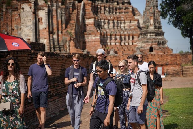 Floating Market and Ayutthaya Guided Day Tour from Bangkok - Maeklong Railway Market and the train that cuts through it