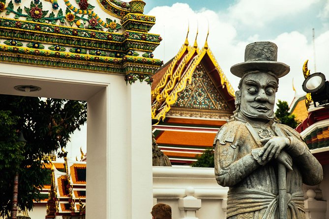 Full Day Bangkok PRIVATE City Tour With Locals - Wat Trimit & Wat Pho tickets - A tuk-tuk ride to Wat Saket