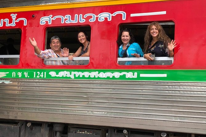 Half-Day Railway Market and Floating Market Tour in Thailand - Arriving by train at Maeklong Railway Market