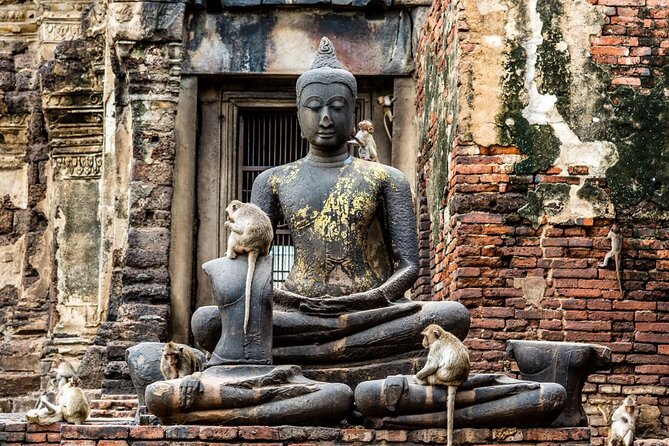 Lopburi Monkey Temple & Ayutthaya Old City Tour From Bangkok - Wat Mahathat and the Buddha head in tree roots