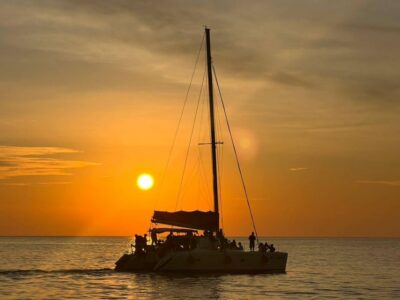 Coral Island & Sunset Dinner by Sailing Catamaran