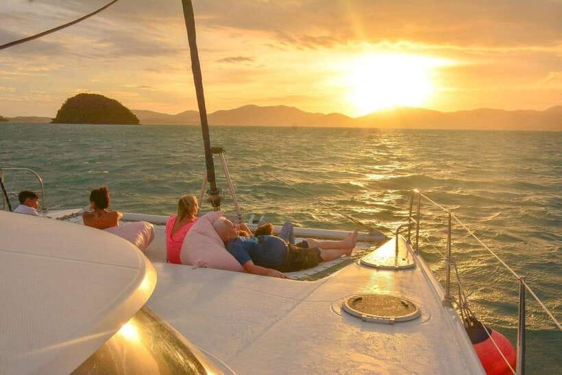 Phuket: Coral Yacht Boat Tour to Coral Island with Sunset - Pickup, pier travel, and the day’s timing