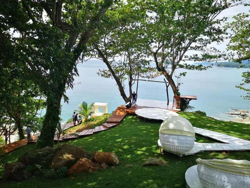 Phuket: Rock Beach Swing Entry Ticket - The beach swing with the turquoise sea behind you