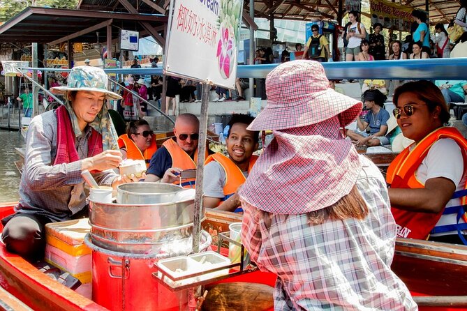 Private Tour from Bangkok: Railway and Floating Markets Tour - Taking the small boat to Damnoen Saduak