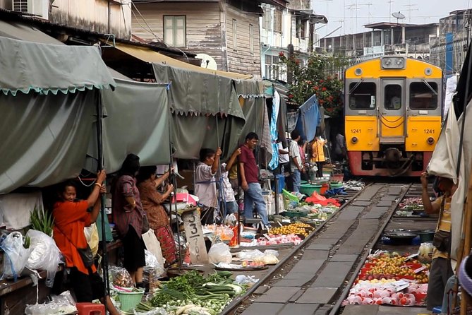 Unique Bangkok Markets: Train Market & Floating Market Adventure - Maeklong Railway Market and the umbrella pause